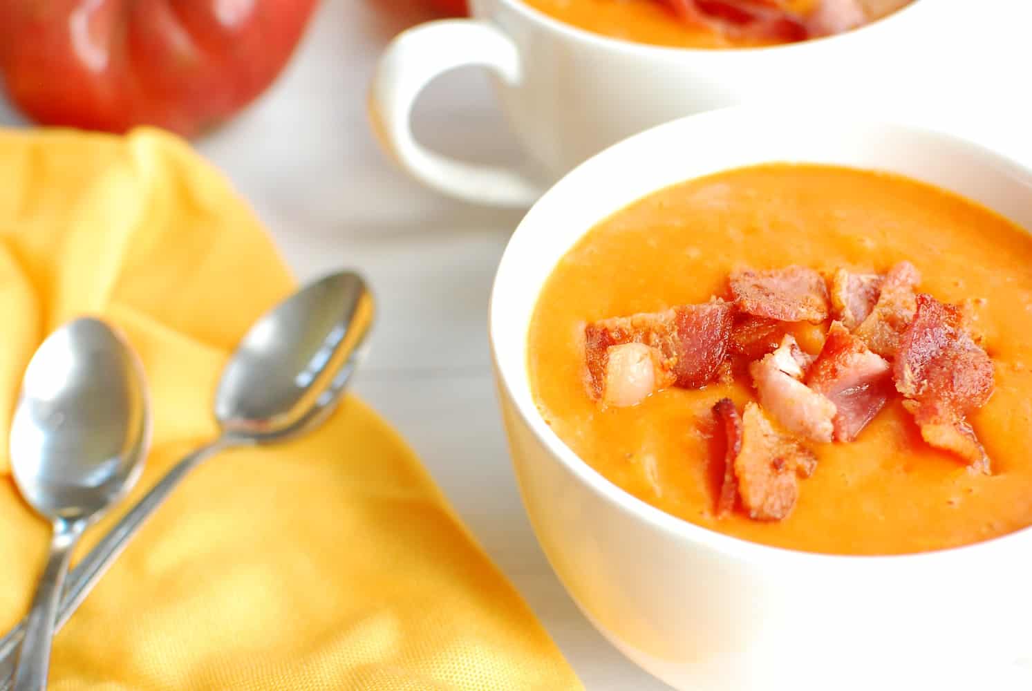 Dairy free tomato soup topped with bacon