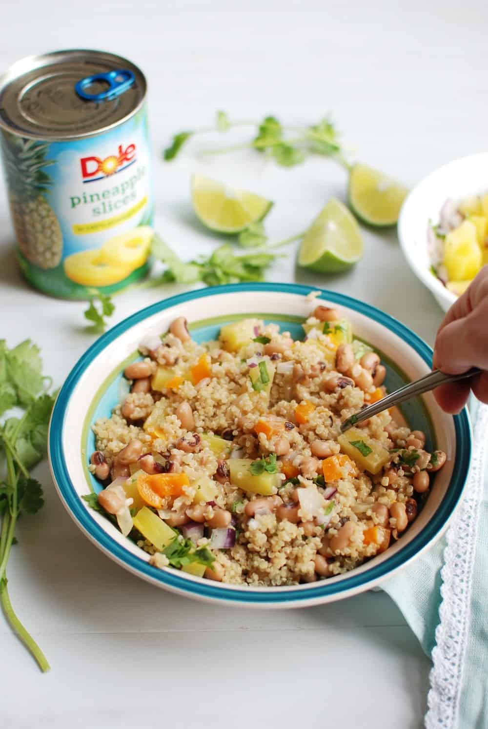 Mixing a bowl of vegan black eyed peas and salsa