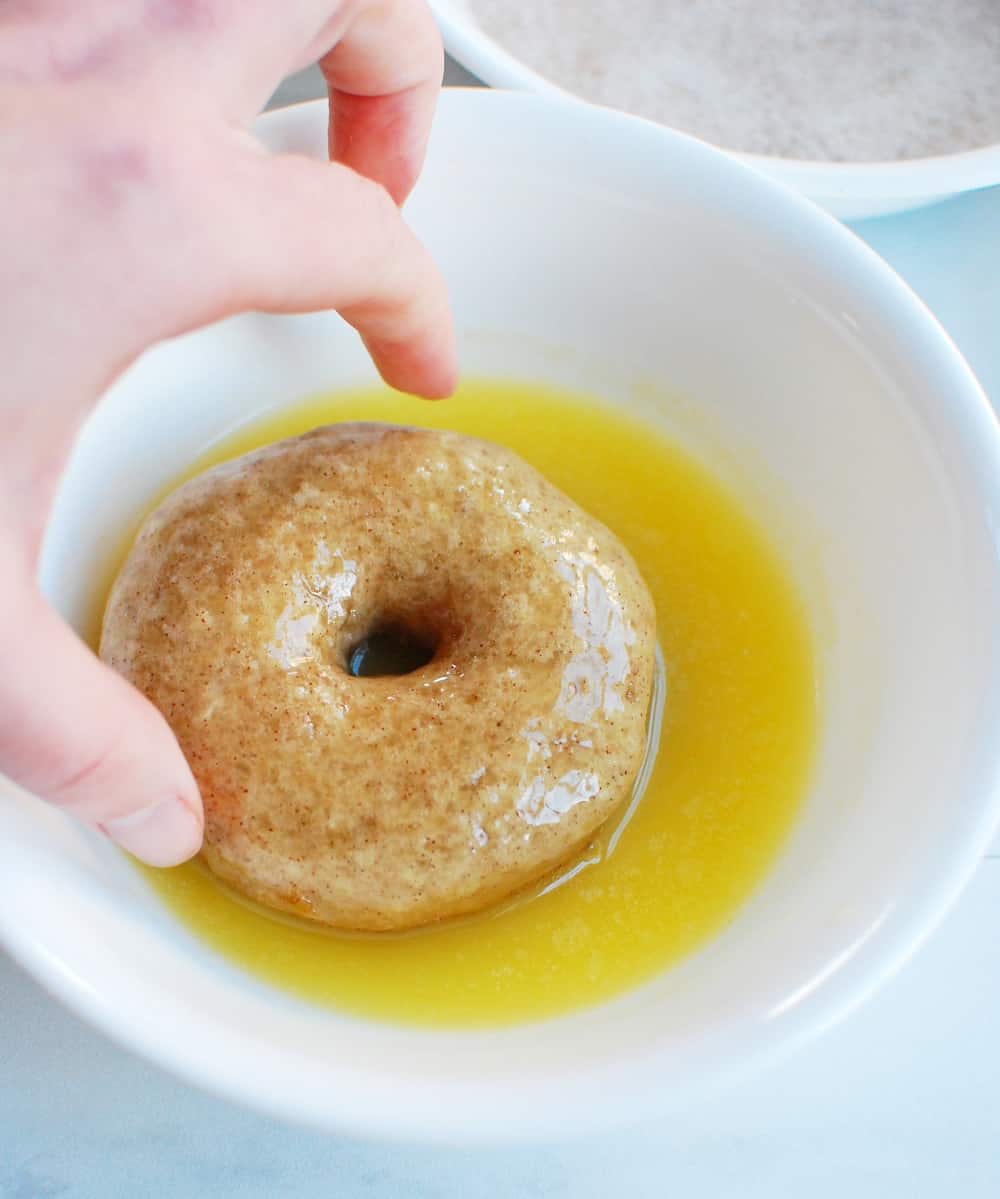 Dipping dairy free donuts in earth balance spread