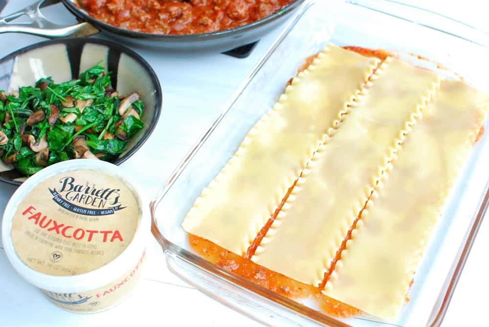 Layering lasagna noodles in a baking dish