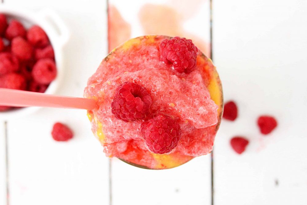 Raspberry topping for the mango raspberry smoothie in a glass