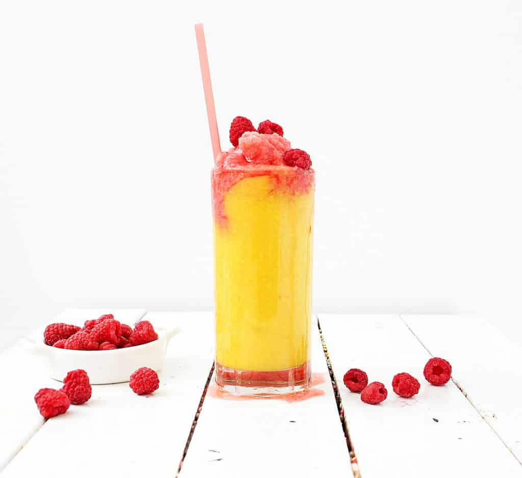 Mango raspberry smoothie in a glass