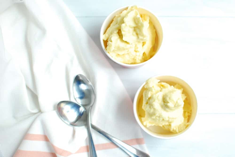 Two cups full of vegan pineapple ice cream