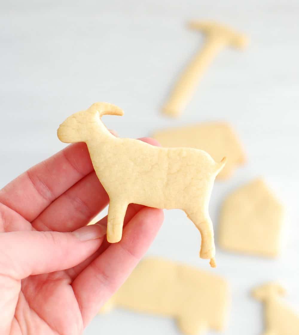 Close up of a goat-shaped dairy free sugar cookie