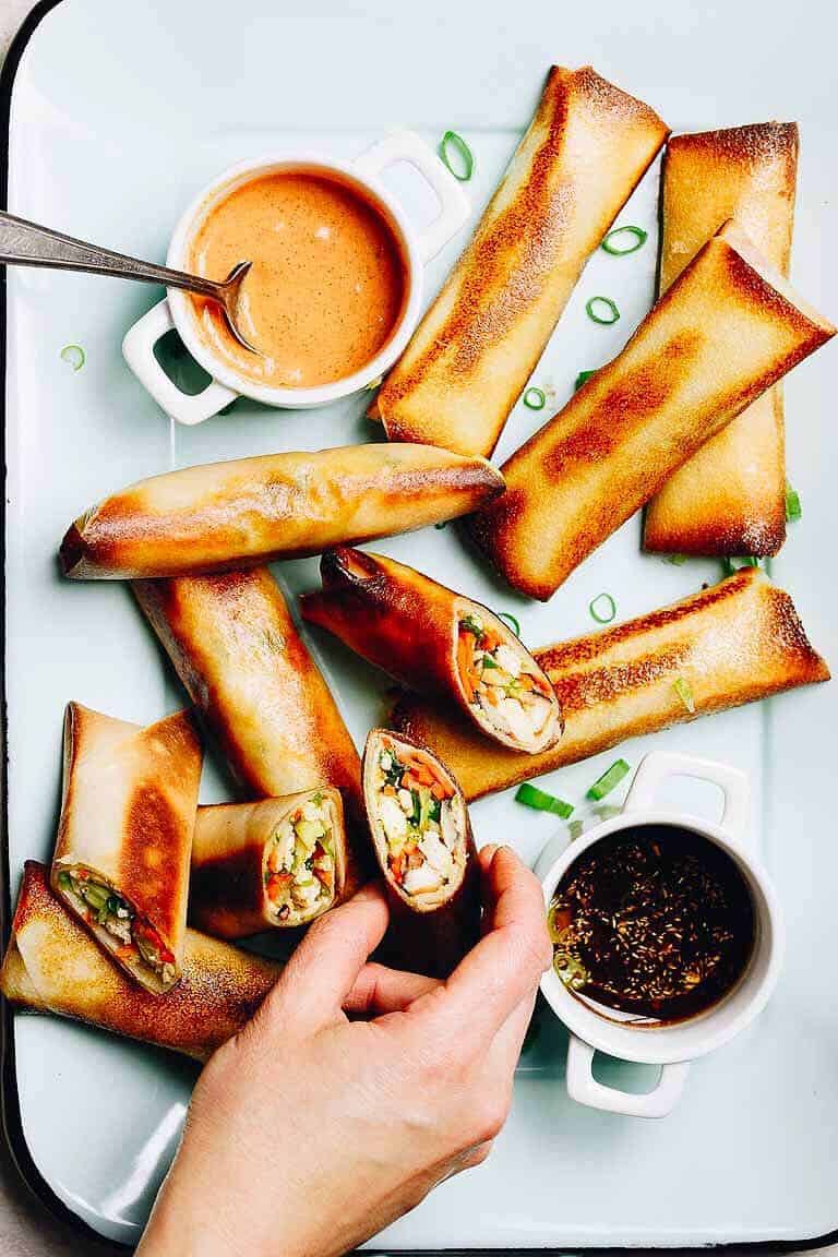 Dairy Free Egg Roll appetizer next to dipping sauce on a white plate