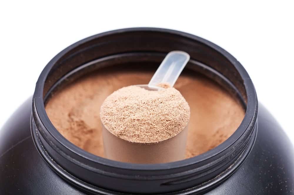 a scoop of chocolate soy free protein powder