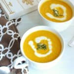 Two mugs full of vegan pumpkin soup