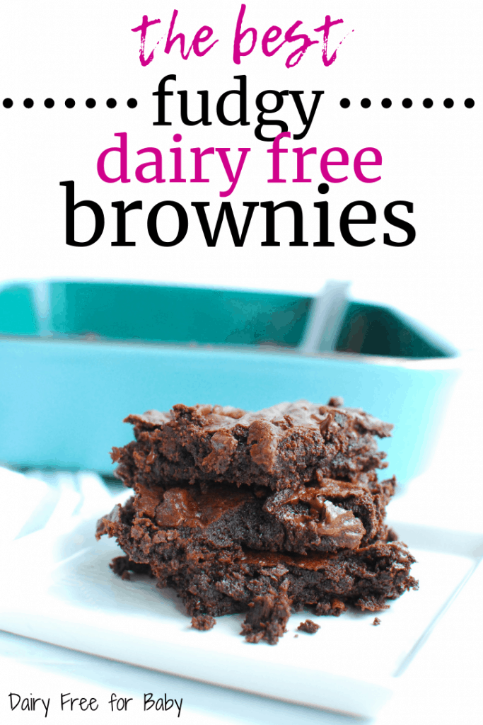 Several dairy free brownies stacked on a white plate