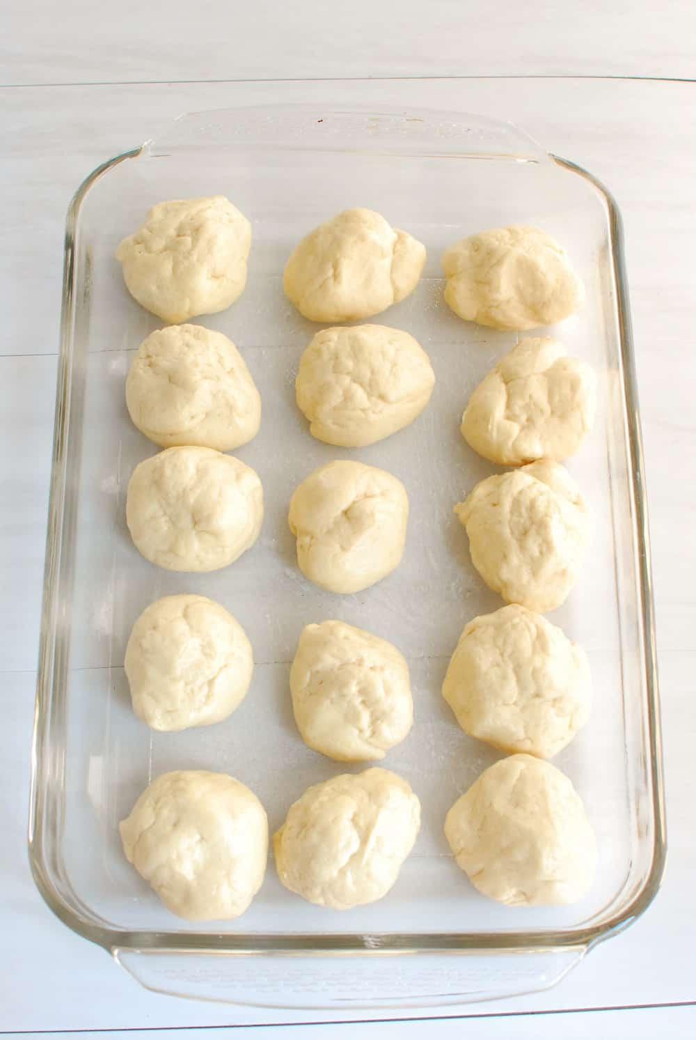 15 dough balls waiting to be baked in the oven