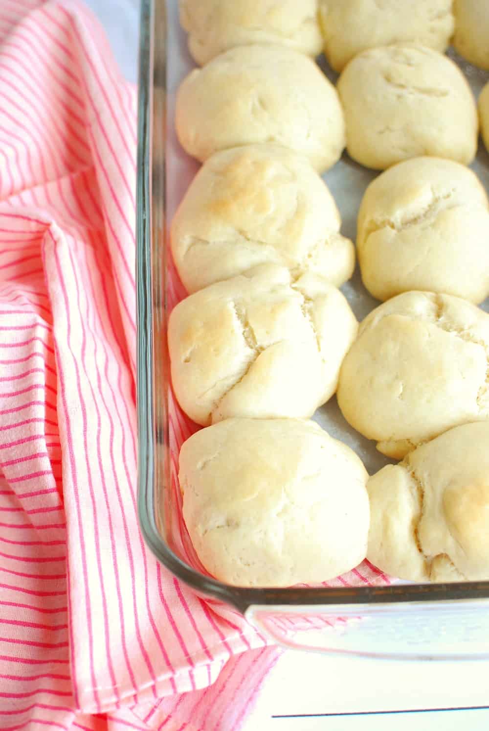 A pan full of cooked vegan hawaiian rolls