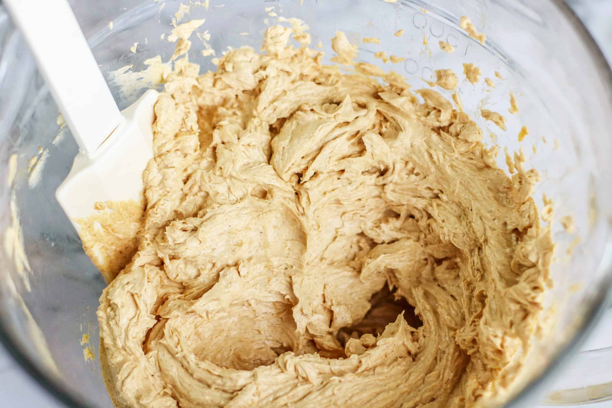 A mixing bowl with all the ingredients to make honey pumpkin butter