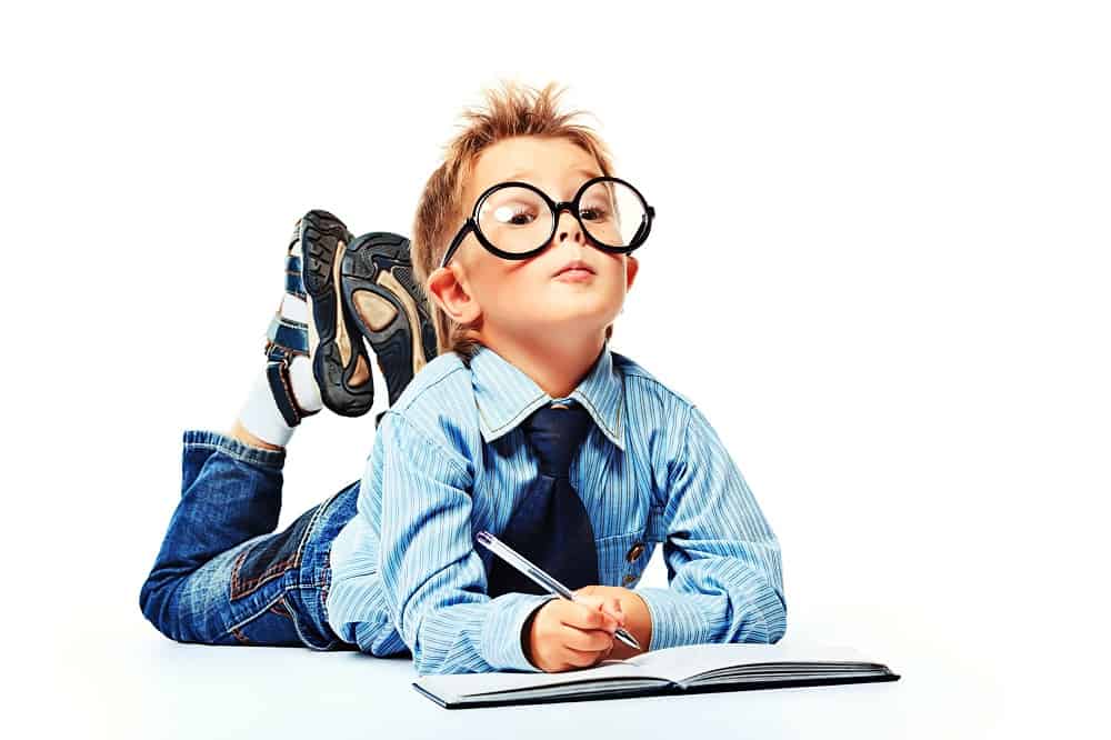 elementary school child in glasses with a book