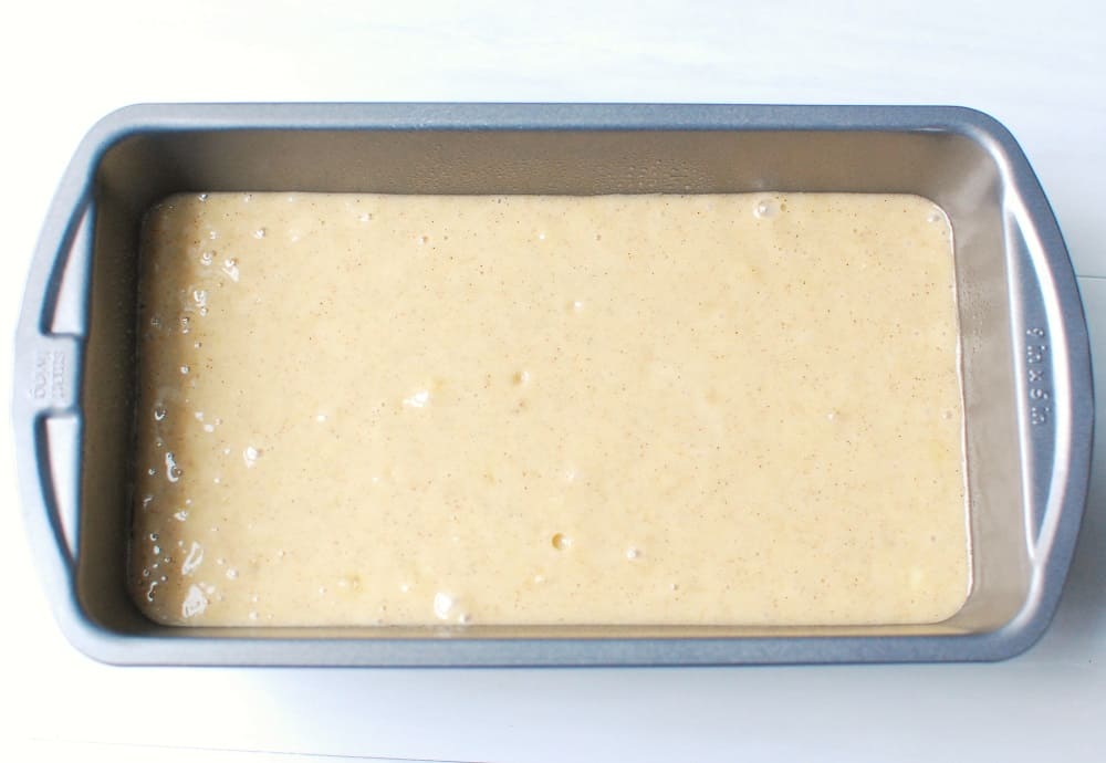 Unbaked banana bread batter in a loaf pan