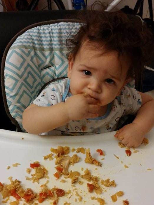 A child eating leftover turkey curry