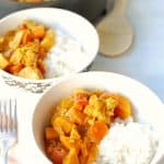 leftover turkey yellow curry in a white bowl