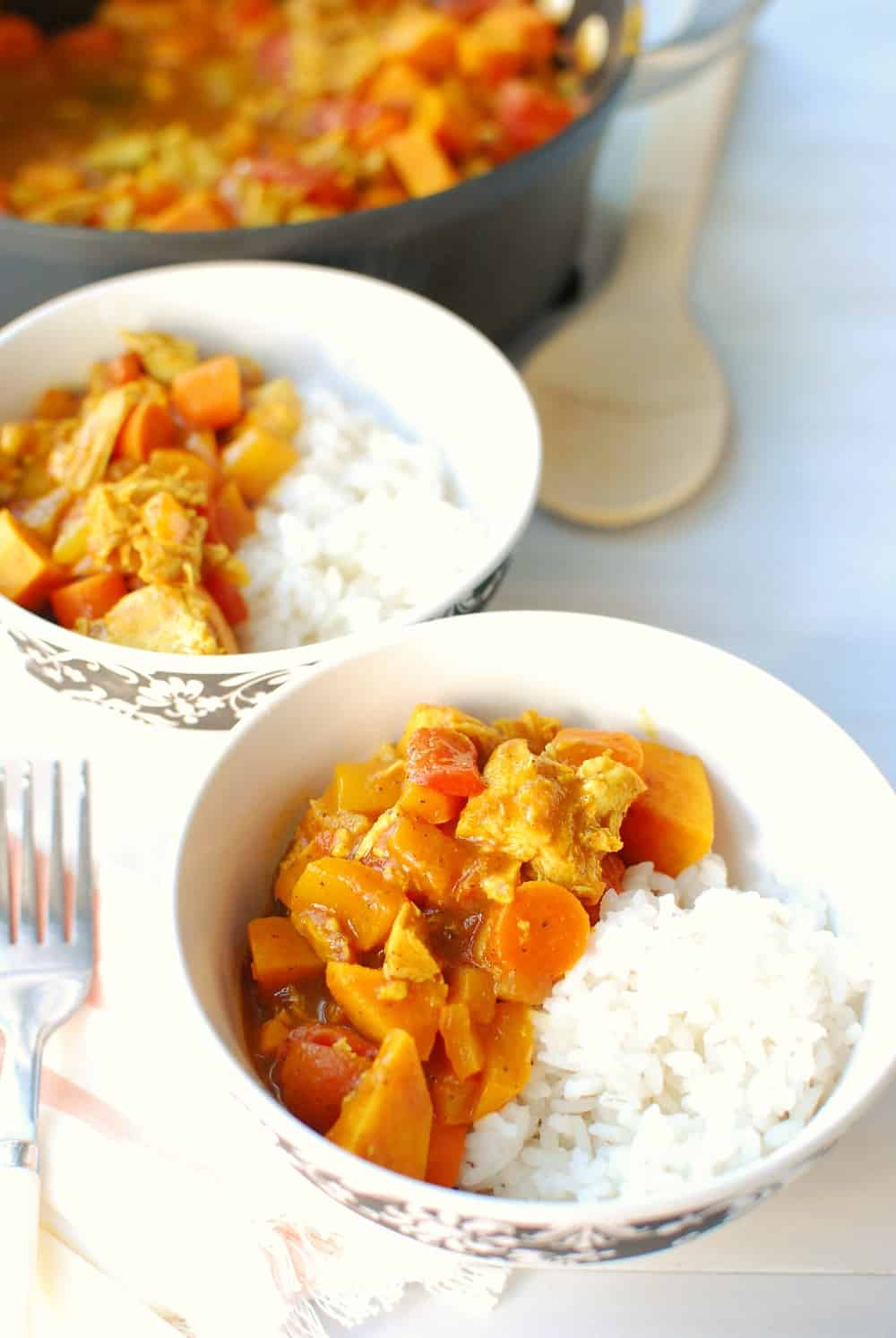 leftover turkey yellow curry in a white bowl