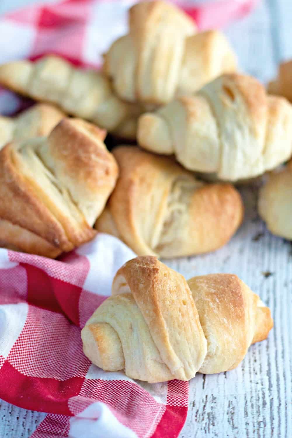 dairy free crescent rolls on a table next to a red napkin