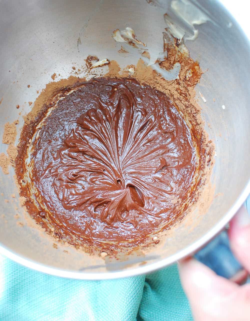 a bowl full of dairy free chocolate frosting