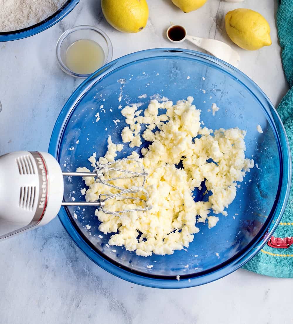 Beating together vegan butter and sugar in a bowl