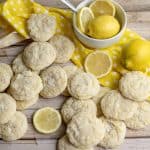 a lot of vegan lemon cookies on a wooden table