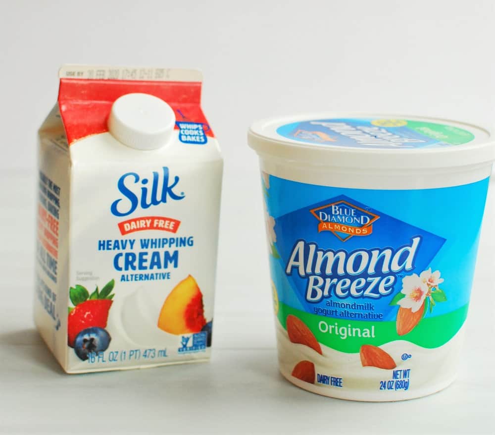 A container of Silk heavy whipping cream and almond breeze yogurt