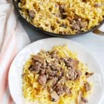 a plate full of egg noodles and ground beef stroganoff