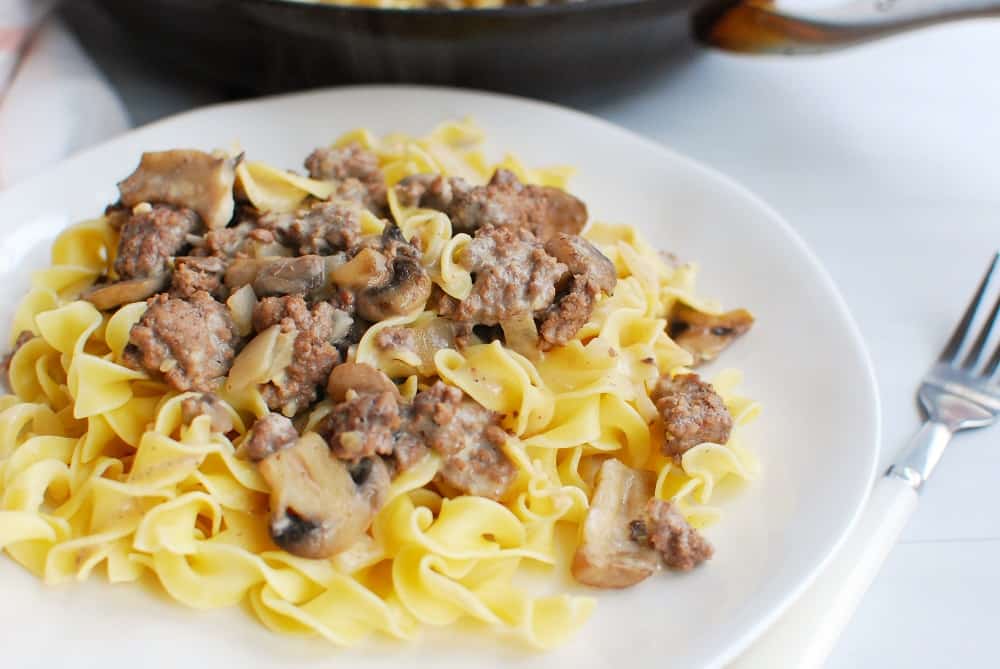 dairy free beef stroganoff on a plate next to a fork