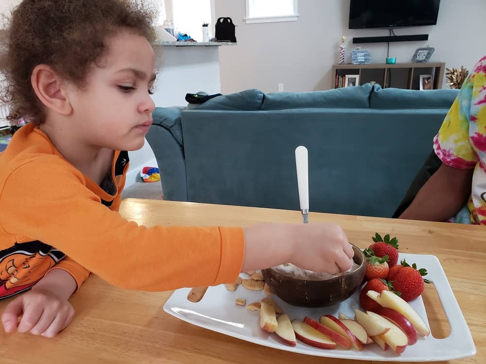 a child eating dairy free cake batter dip