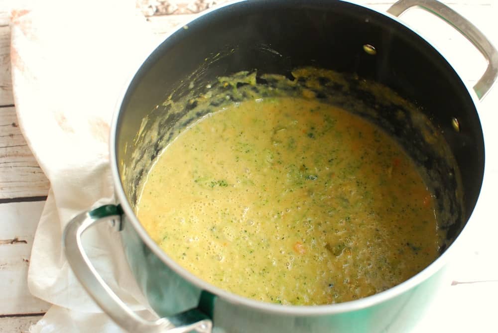 a green pot full of soup