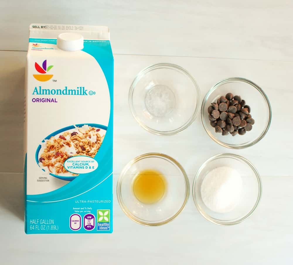 a container of almond milk, vanilla, salt, chocolate chips, and sugar