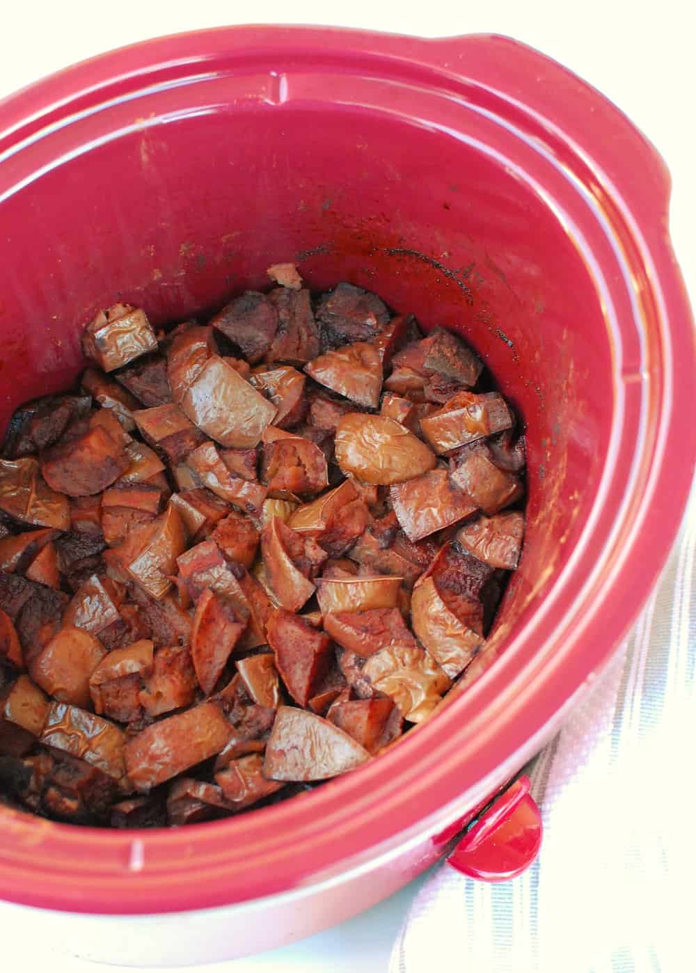 fully cooked apples in the slow cooker, before blending