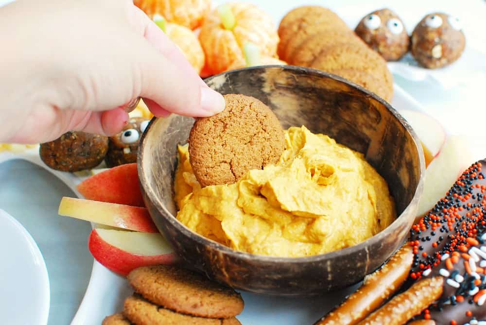 Pumpkin dip on a Halloween charcuterie board with gingersnaps