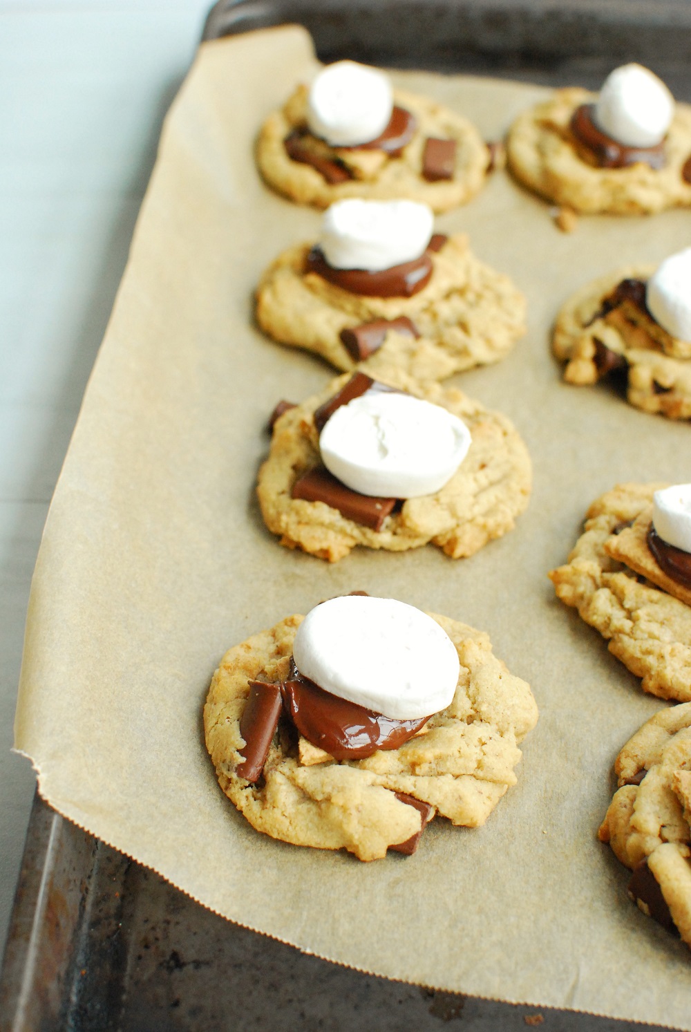 a baking sheet full of freshly baked vegan smores cookies