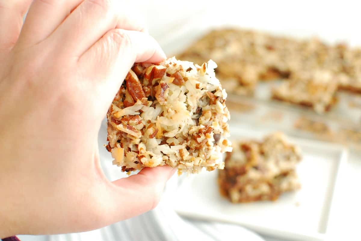 a woman's hand holding a dairy free magic bar