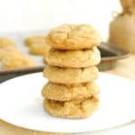 a stack of five dairy free molasses cookies on a white plate
