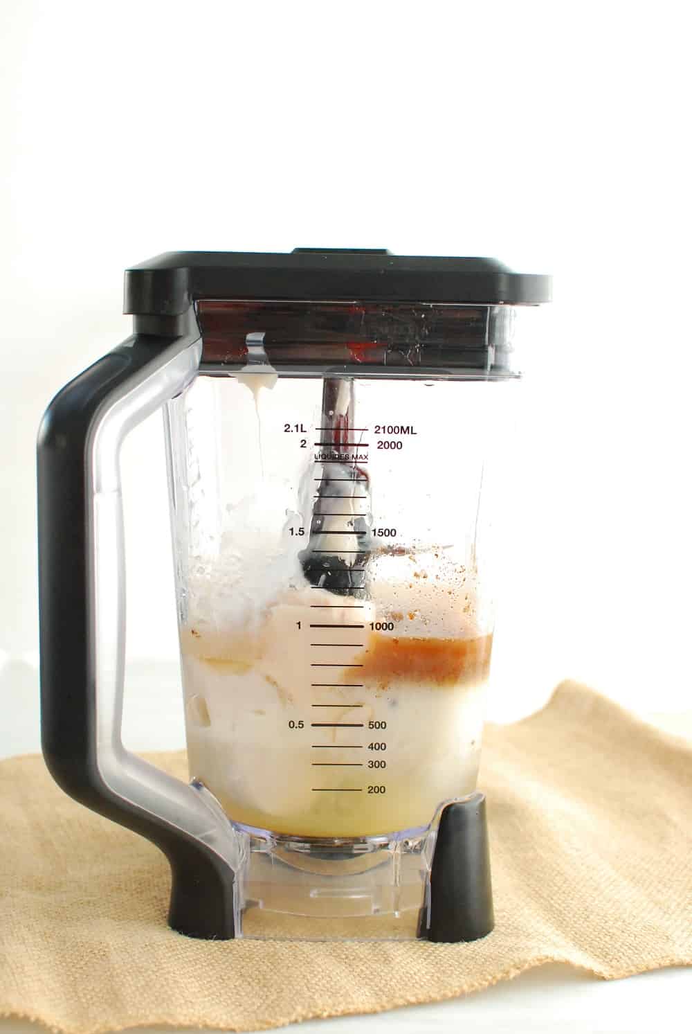 a blender filled with ingredients to make dairy free coquito