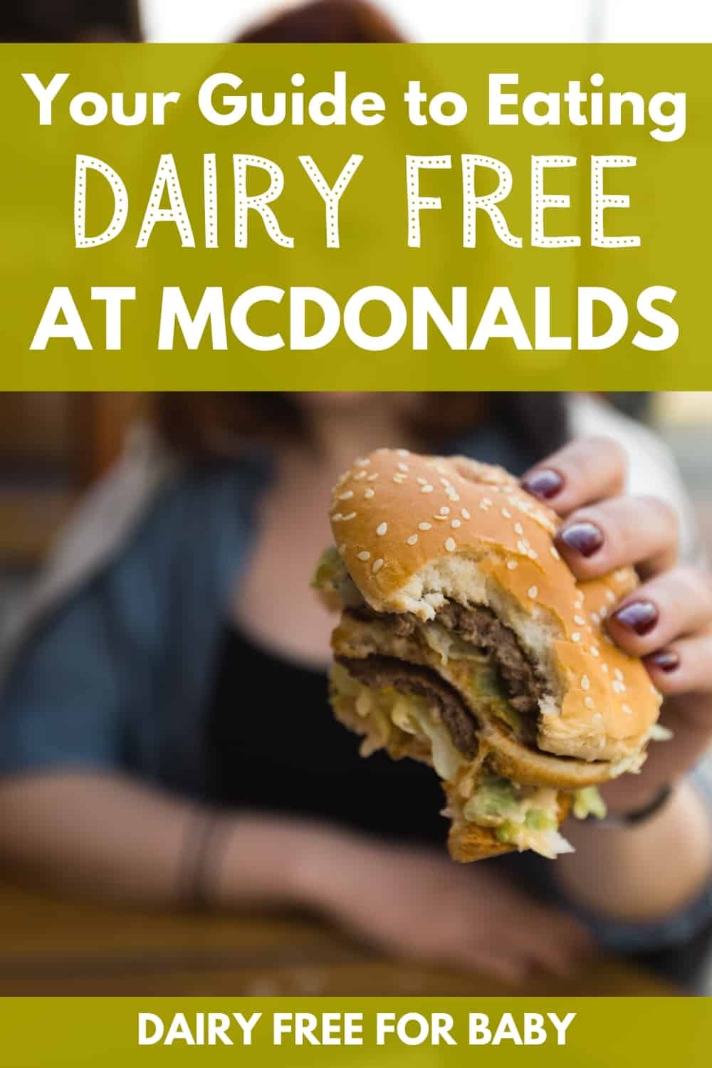 a woman holding a double hamburger with a text overlay that says your guide to eating dairy free at mcdonalds