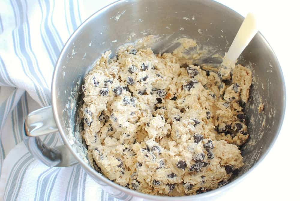 Cooke dough in a silver mixing bowl.