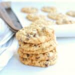 A stack of dairy free oatmeal cookies with chocolate chips and walnuts.