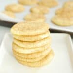 seven dairy free snickerdoodles stacked on a plate