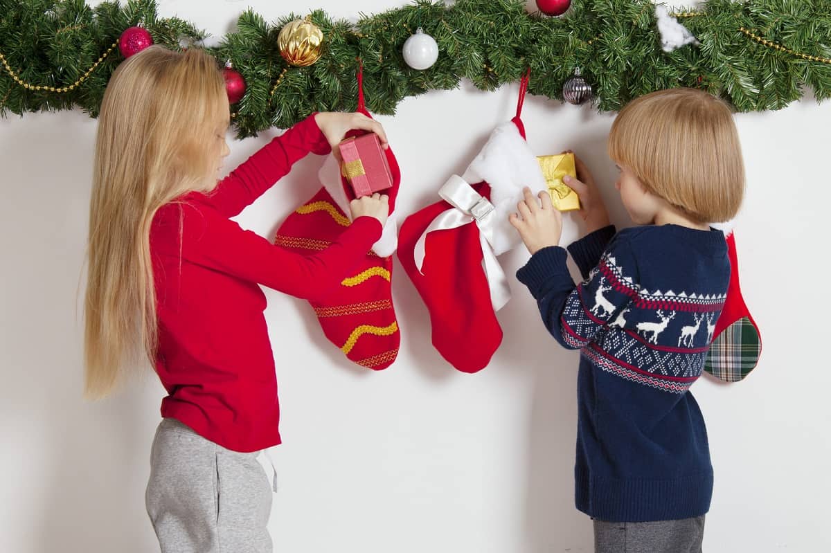 two children looking in their stockings