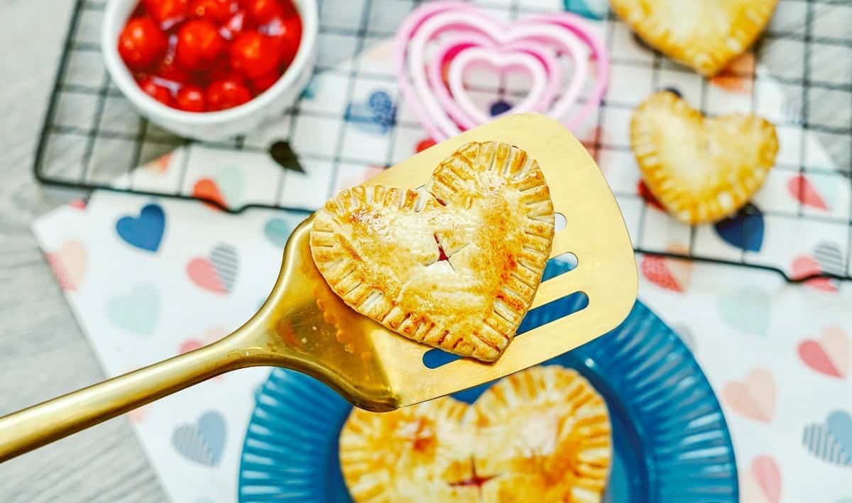 An air fryer cherry hand pie on a spatula.