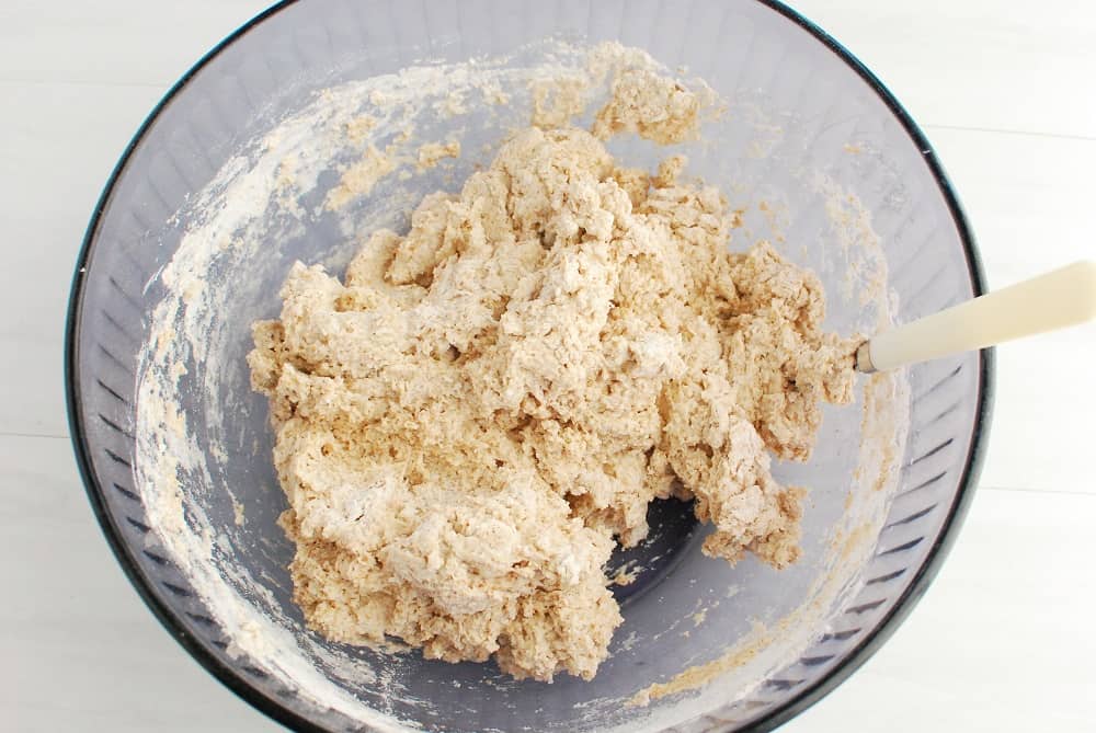 A bowl with bread dough in it.