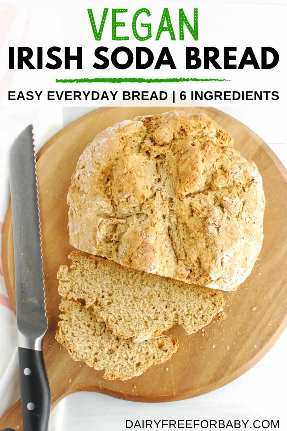 A loaf of vegan Irish soda bread on a cutting board with two slices cut.