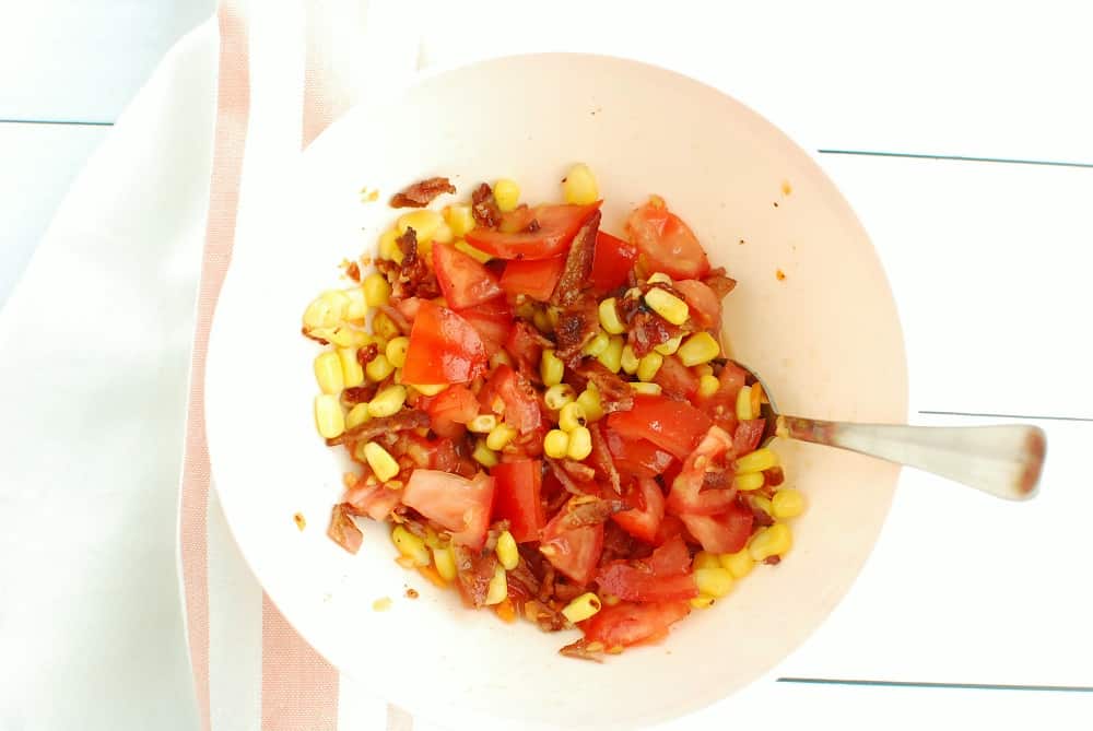 A bowl with habanero, corn, tomato, and bacon salsa.
