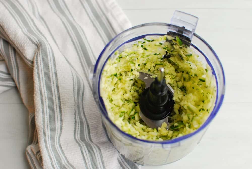 Zucchini chopped up in a mini food processor.