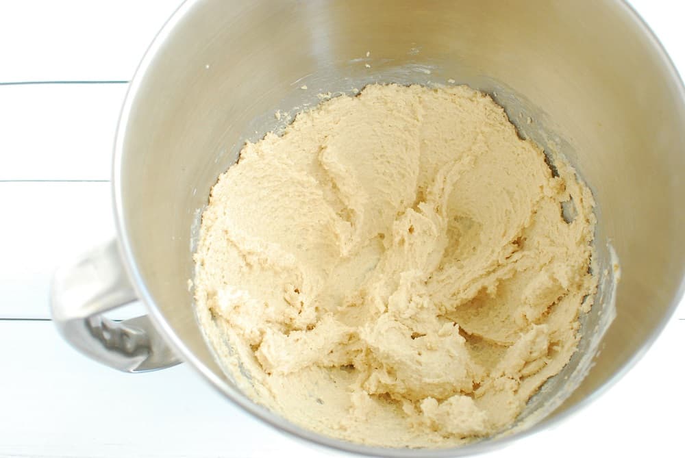 A mixing bowl with dairy free butter and sugar that has been creamed together.