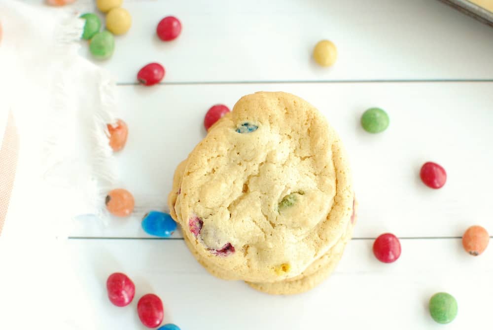 Overhead shot of a dairy free candy cookie next to some extra candies.