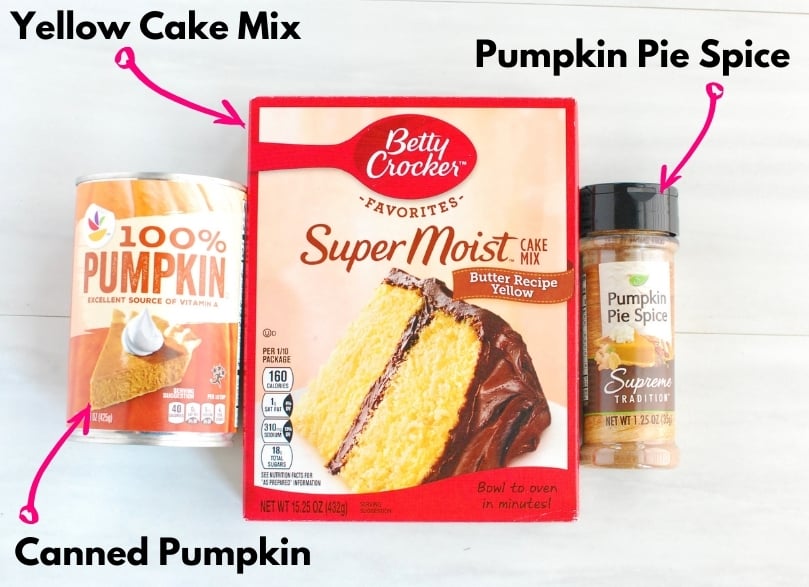 A box of yellow cake mix, a can of pumpkin, and a jar of pumpkin pie spice.