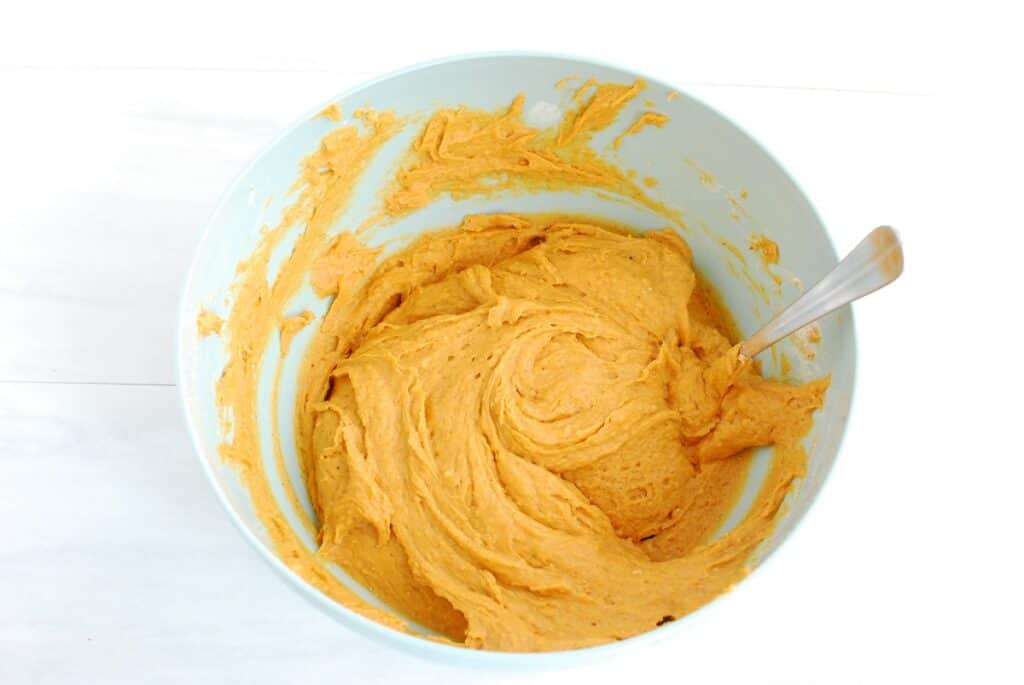 Pumpkin muffin batter in a bowl.